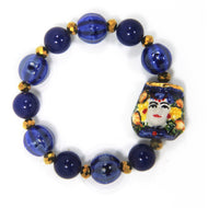 WOMAN ELASTIC BRACELET WITH CALTAGIRONE HEAD IN HAND PAINTED CERAMIC. MADE IN ITALY.