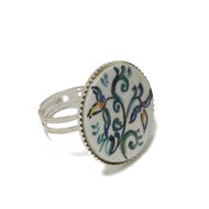 Adjustable ring with light blue flowers