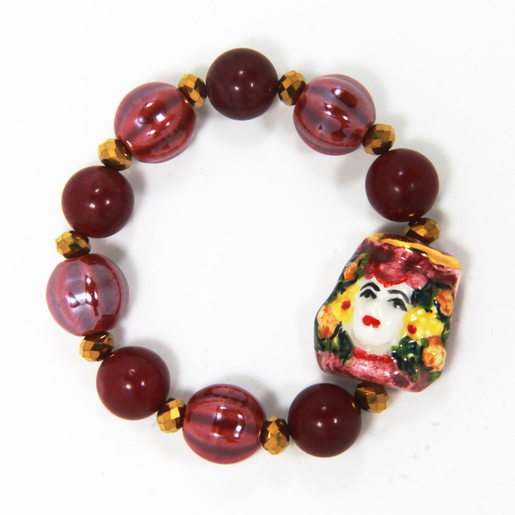 WOMAN ELASTIC BRACELET WITH CALTAGIRONE HEAD IN HAND PAINTED CERAMIC. MADE IN ITALY.