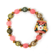 Elastic bracelet with hand-painted ceramic head