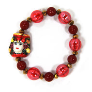 Elastic bracelet with hand-painted ceramic head